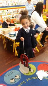 There was a paper fastener in the mouth of this fish. We caught the fish! Therefore it is made of metal and sticks to a magnet!